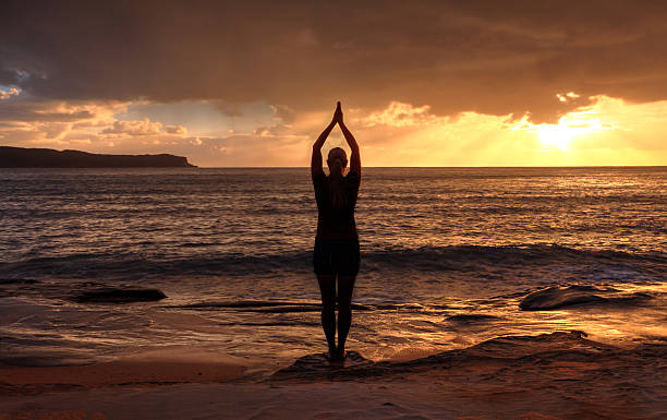 Tadasana (Mountain Pose) at sunrise—grounding practice for stress relief- blogs.myhealthlogy.com
